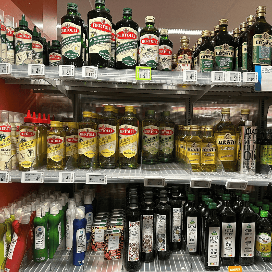 Olijfolie supermarkt schap sept 2026